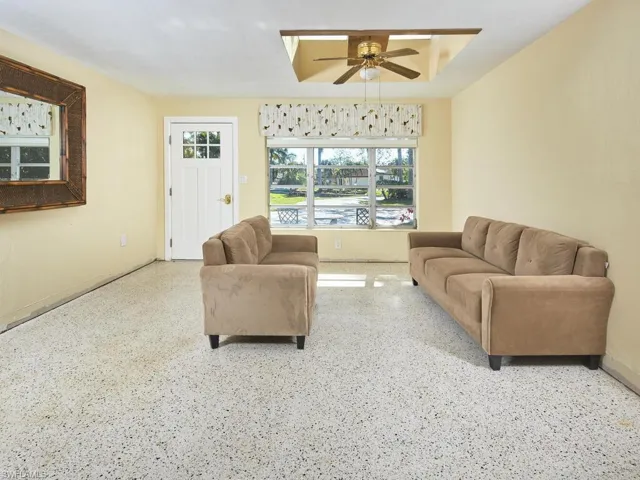Formal living room with a beautiful sky light.