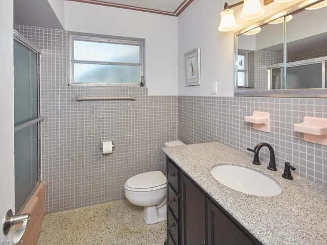 Bathroom features updated vanity.