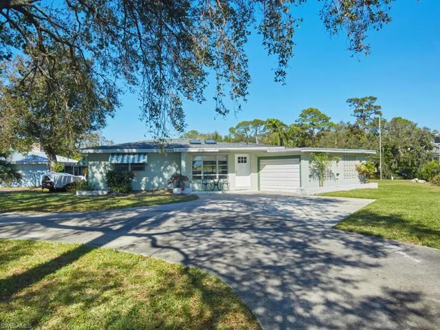 Front of home - notice the large driveway.