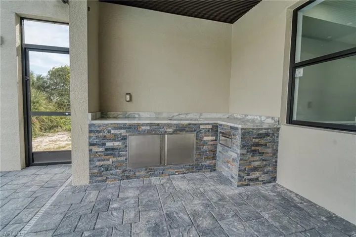 View of patio with area for grilling