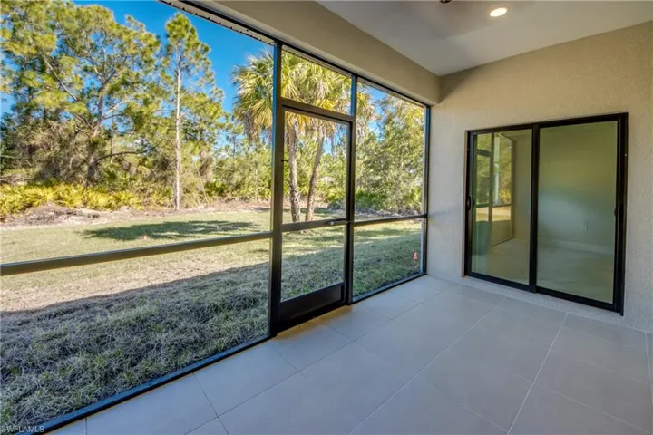 Unfurnished sunroom with plenty of natural light