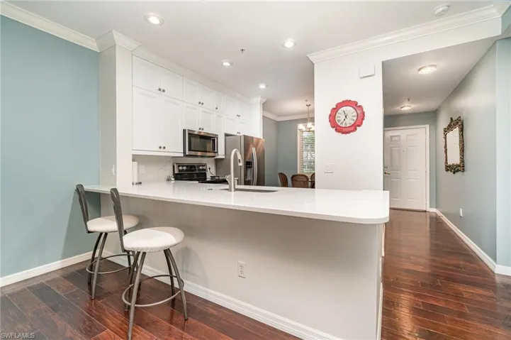 Completely remodeled kitchen as of 2023 with appliances with stainless steel appliances,dark wood-style floors, and recessed lighting