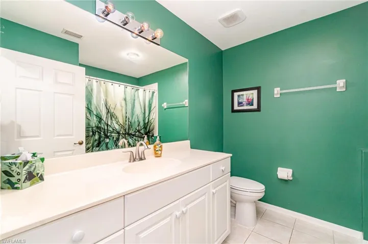 Laundry room - newer washer & dryer with cabinet space, independent washer and dryer, and tile patterned flooring