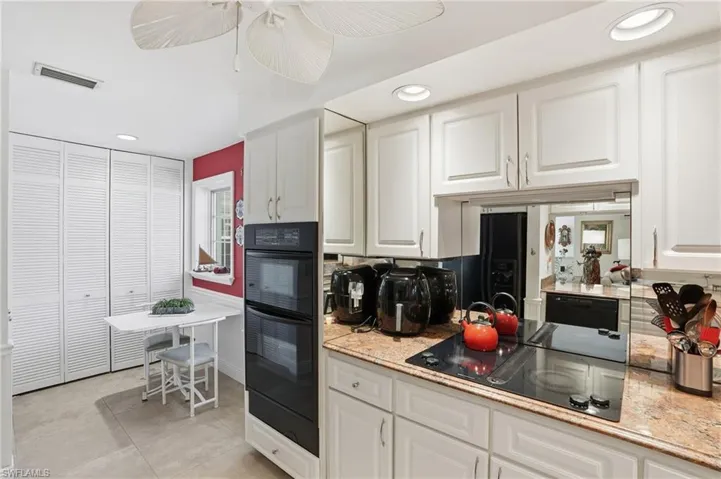 This kitchen features a charming breakfast room and plenty of storage