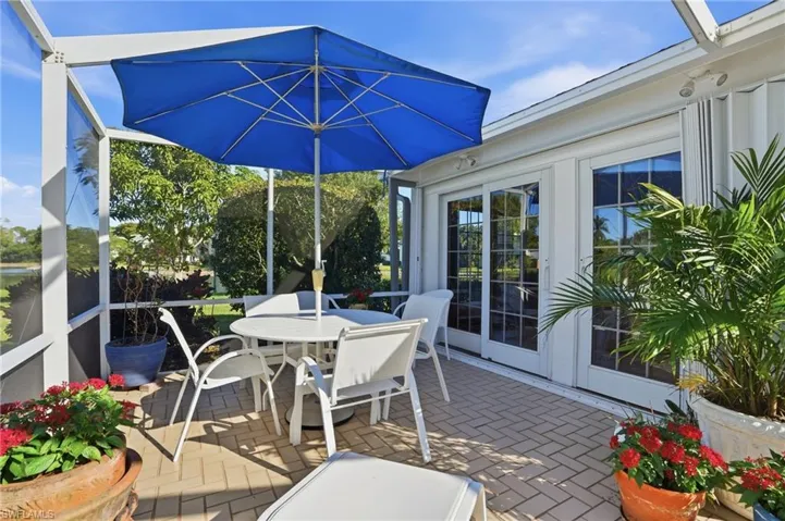 The screened lanai features the best of the indoor/outdoor lifestyle with lake views