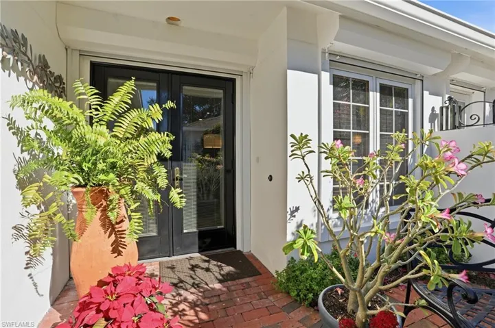 Front door behind a private fenced courtyard