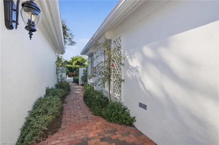 Behind the privacy of the gate is this charming paver courtyard