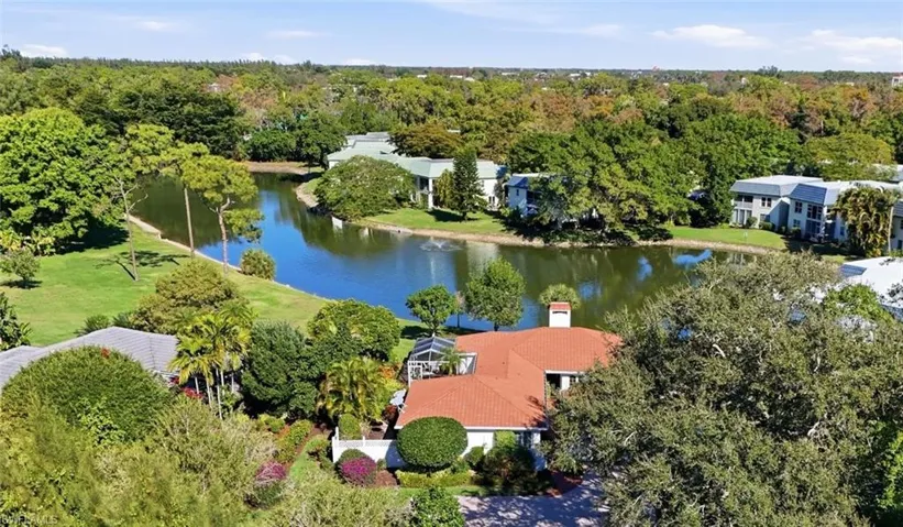 home sits on a lake with a peaceful setting