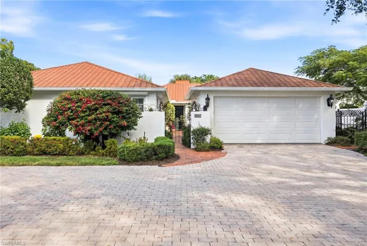 This unique home features a fenced yard with several courtyards to enjoy the indoor/outdoor lifestyle in Florida