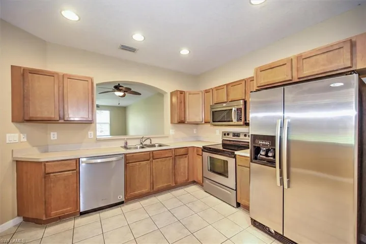 Another view of stainless steel and maple kitchen!