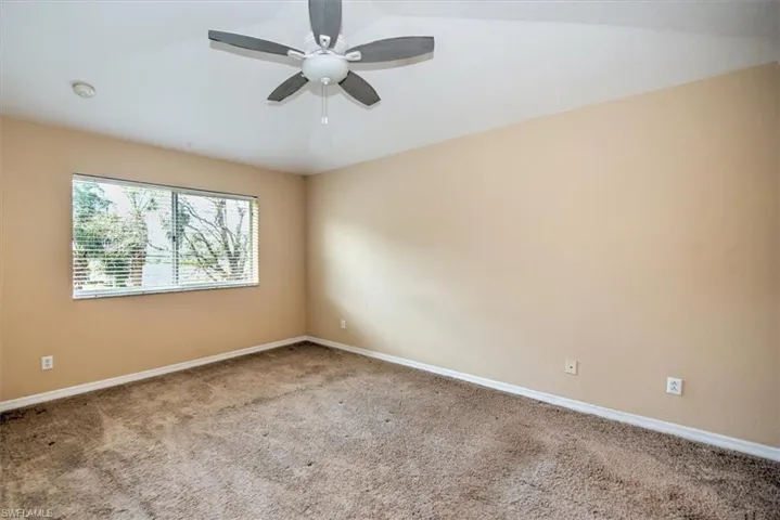 Spacious master bedroom with double window and lighted ceiling fan!