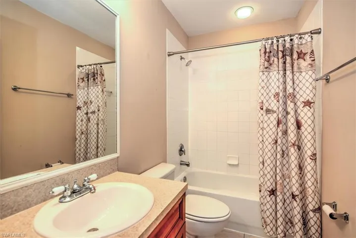 Main bathroom with tiled tub - shower!