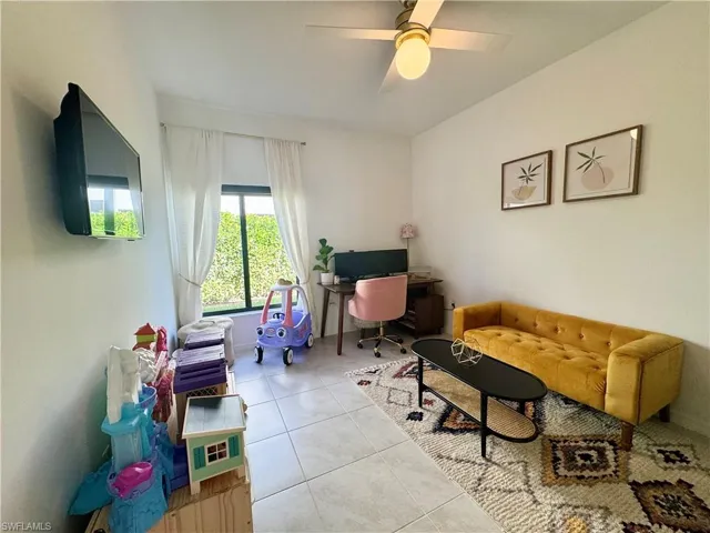 Office featuring tile patterned flooring and ceiling fan
