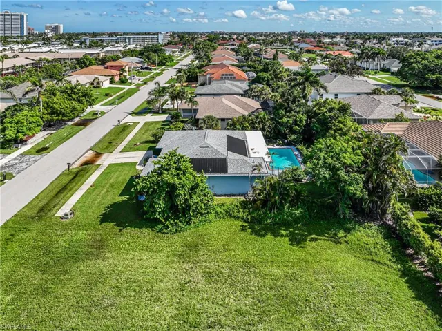 Aerial perspective of suburban area with a pool area