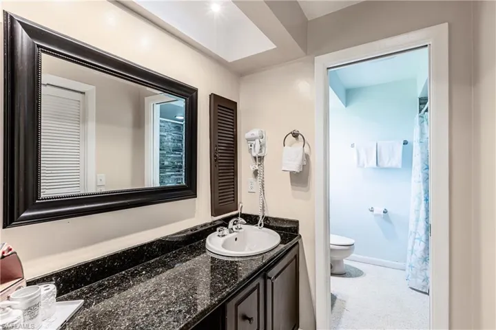 Full bathroom with vanity and a shower with curtain