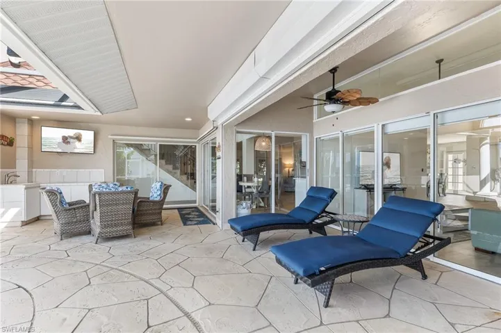 View of patio featuring a ceiling fan and outdoor dining space