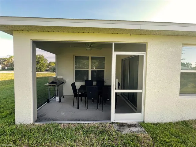 View of patio featuring grilling area and a ceiling fan