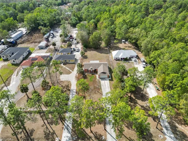 Aerial perspective of suburban area with a heavily wooded area
