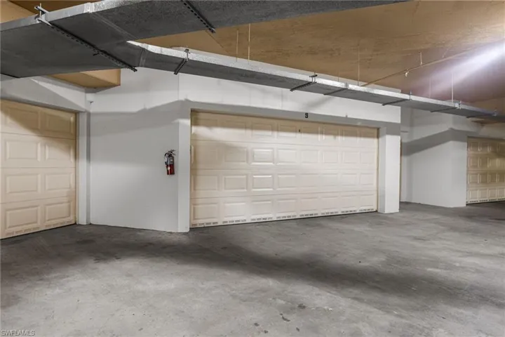 This garage is actually a 2 1/2 car garage.  You can fit 2 cars and a golf cart.