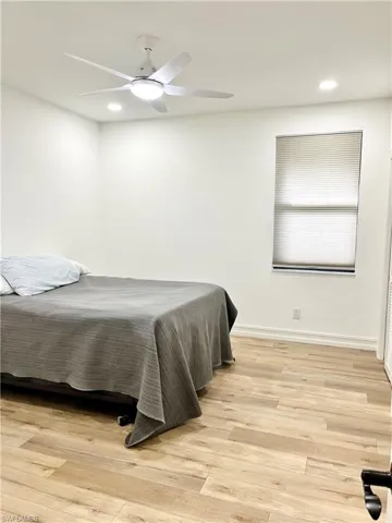 Bedroom 2 with ceiling fan, a closet, and jack and Jill bathroom