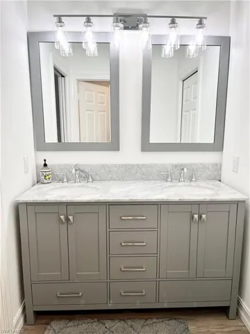 Bathroom 2 featuring vanity and wood-type flooring