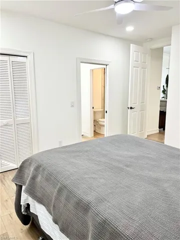 Bedroom 2 with ceiling fan, a closet, and jack and Jill bathroom