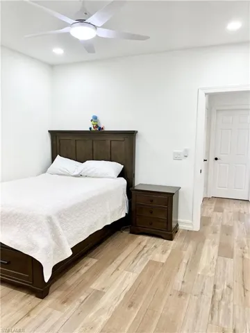 Bedroom 3 with ceiling fan and light hardwood / wood-style floors