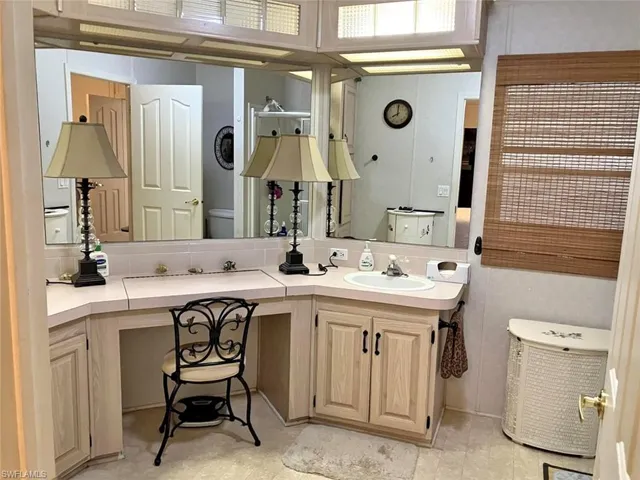 Full bath featuring toilet and vanity