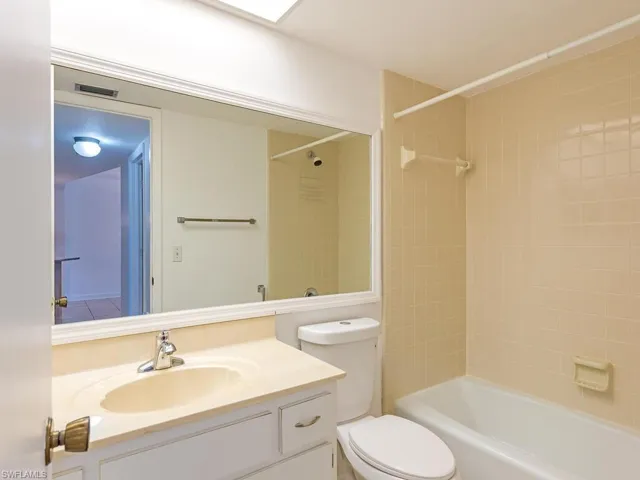 Bathroom featuring vanity and shower / tub combination