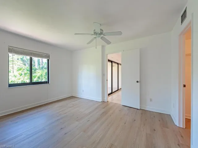 Unfurnished bedroom featuring light wood-type flooring and ceiling fan