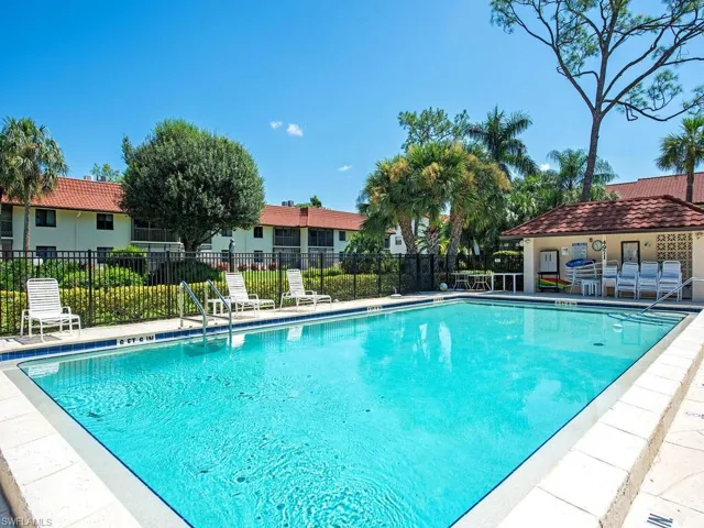 Community pool with a patio area