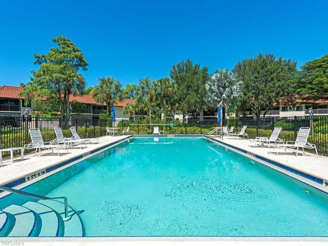 Community pool featuring a patio area