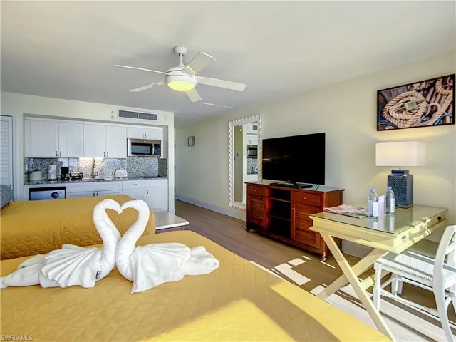 Living room featuring light hardwood / wood-style flooring and ceiling fan