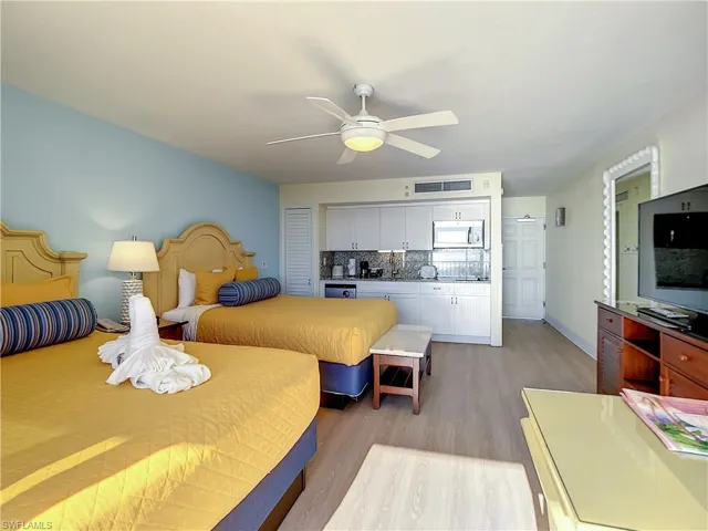 Bedroom featuring ceiling fan and light hardwood / wood-style flooring