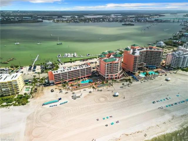 Birds eye view of property with a water view