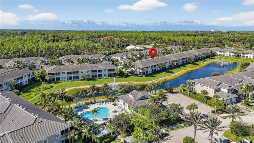 Bird's eye view of a pool area and a large body of water