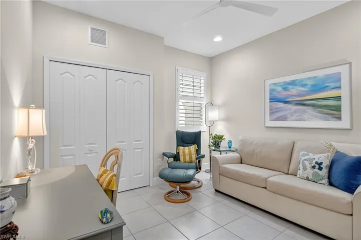 Office area featuring light tile patterned floors, recessed lighting, and ceiling fan