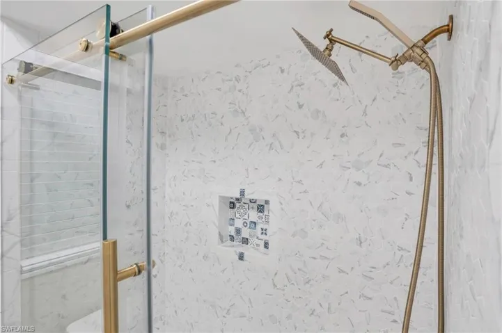 Bathroom with a shower with door