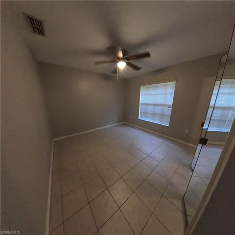 546 Whispering Wind Bend, Lehigh Acres, Florida 33974