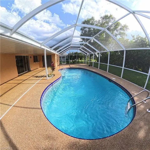 546 Whispering Wind Bend, Lehigh Acres, Florida 33974