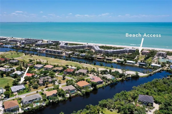 Aerial overview of property's location featuring a large body of water