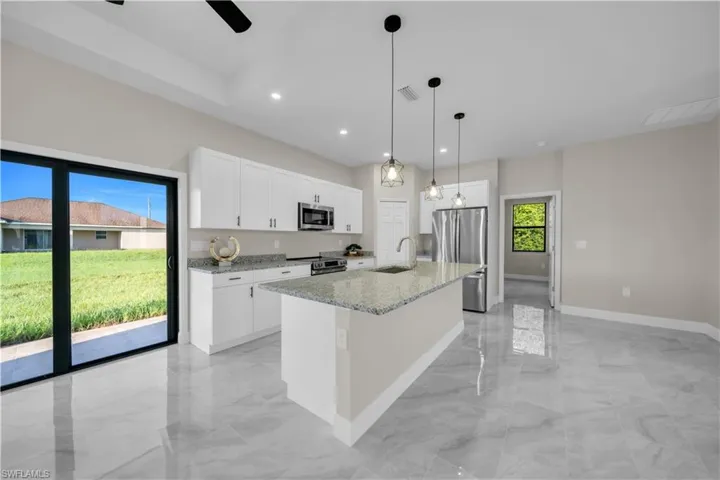 Unfurnished bedroom featuring a closet, a ceiling fan, and light marble finish floors