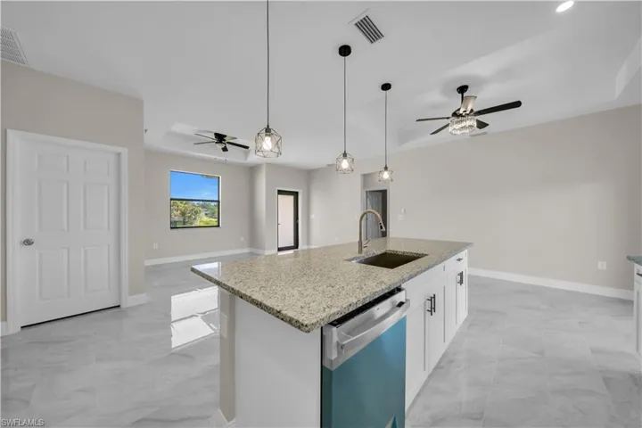 Laundry room featuring washer hookup, light marble finish flooring, and electric dryer hookup