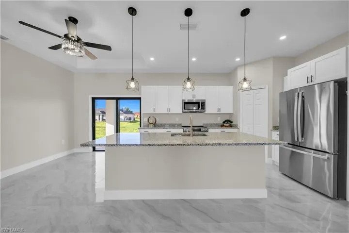 Unfurnished room featuring baseboards and a ceiling fan