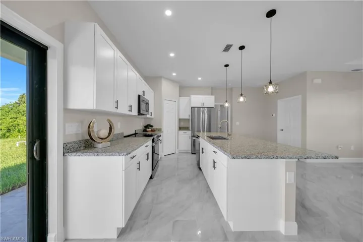 Unfurnished bedroom featuring a closet, a ceiling fan, and light marble finish floors