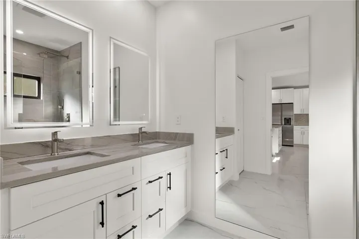 Guest House Bathroom with tiled shower and vanity