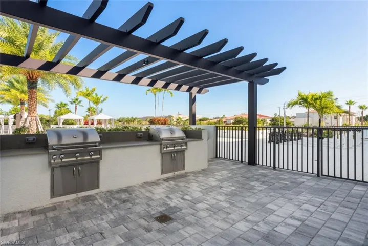 View of patio / terrace featuring area for grilling and a pergola