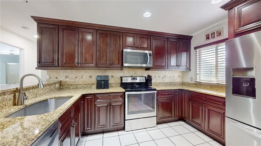 Kitchen with granite countertops, and stainless steel appliances