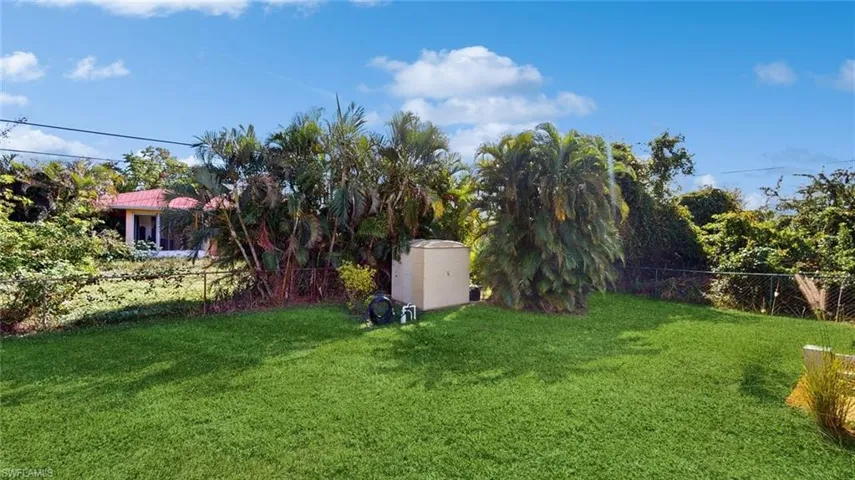 View of yard featuring a storage shed
