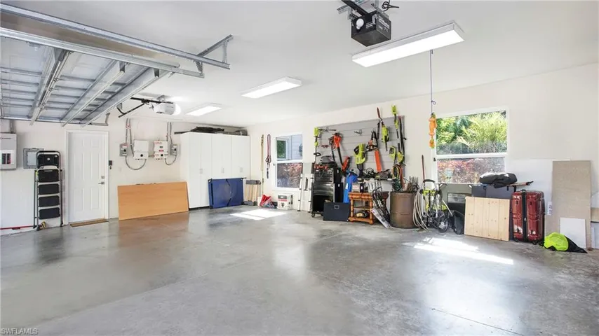 Garage featuring a garage door opener